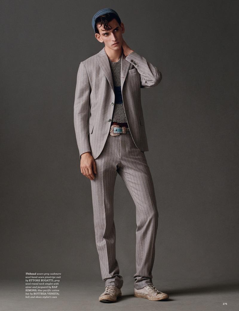 Thibaud Charon embraces soft spring sentiments in a grey pinstripe suit from Ettore Bugatti.