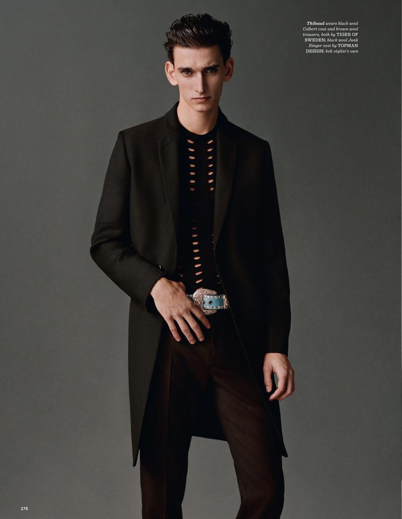 Thibaud Charon dons a long tailored coat and slim-cut trousers from Tiger of Sweden.