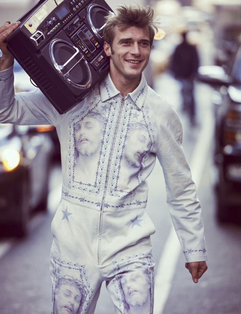 Clément Chabernaud models a white jumpsuit from Givenchy.