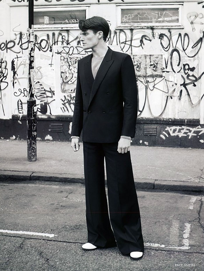 Danny Beauchamp steps out in an oversized double-breasted suit with flared trousers from Paul Smith.