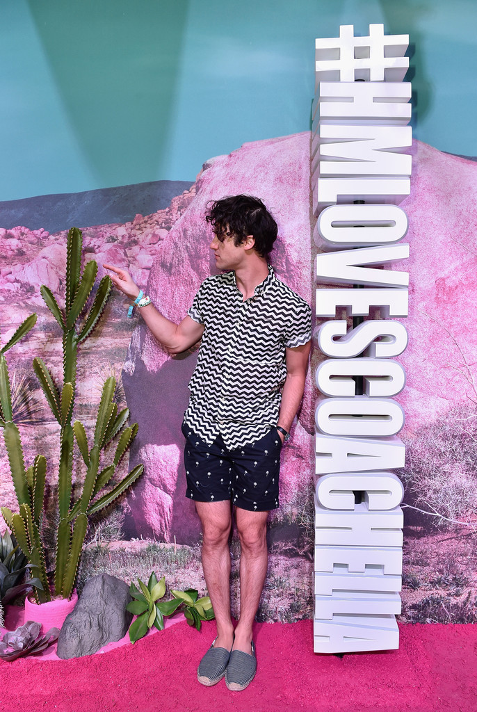 Darren Criss takes in the atmosphere at the H&M Loves Coachella Pop Up.