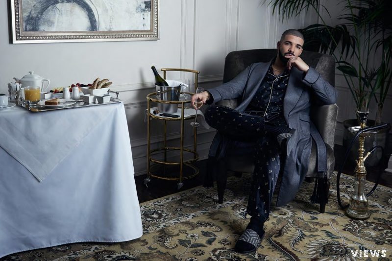 Clad in patterned pajamas and a robe, Drake retreats indoors as he lounges in style.