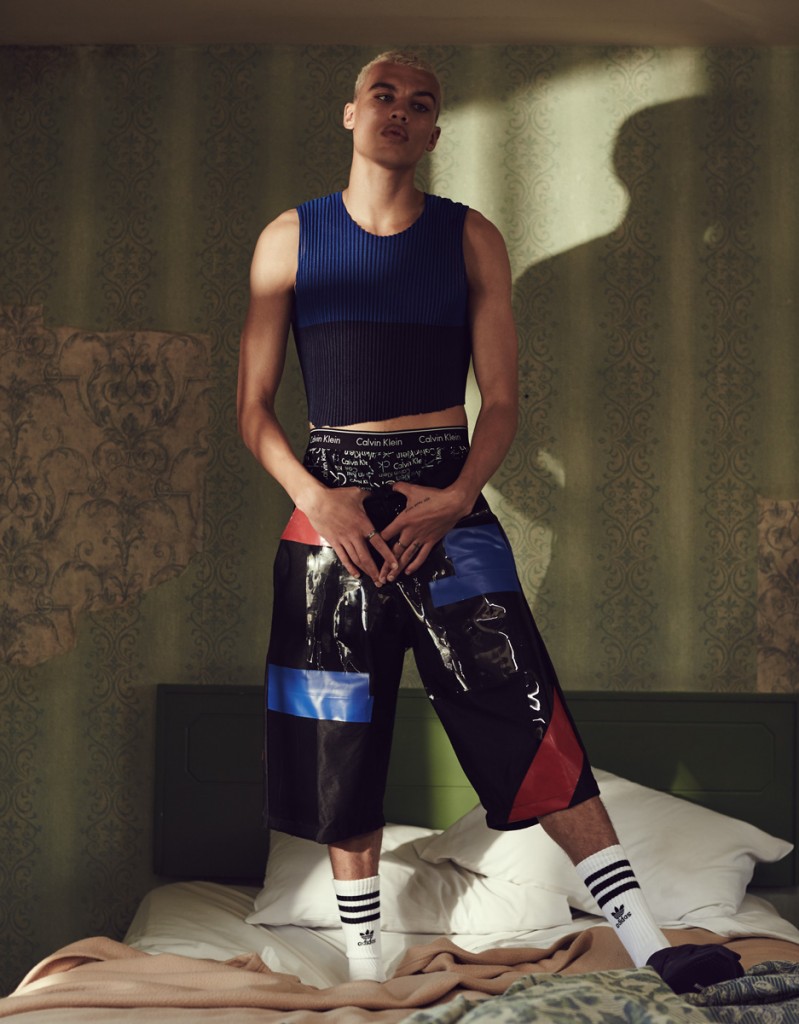 Dudley O'Shaughnessy makes quite the 90s style statement in a crop top from Issey Miyake, paired with KTZ shorts.