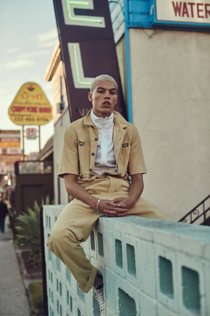 Dudley O'Shaughnessy sports a Kenzo jumpsuit with a Kenneth Cole top.