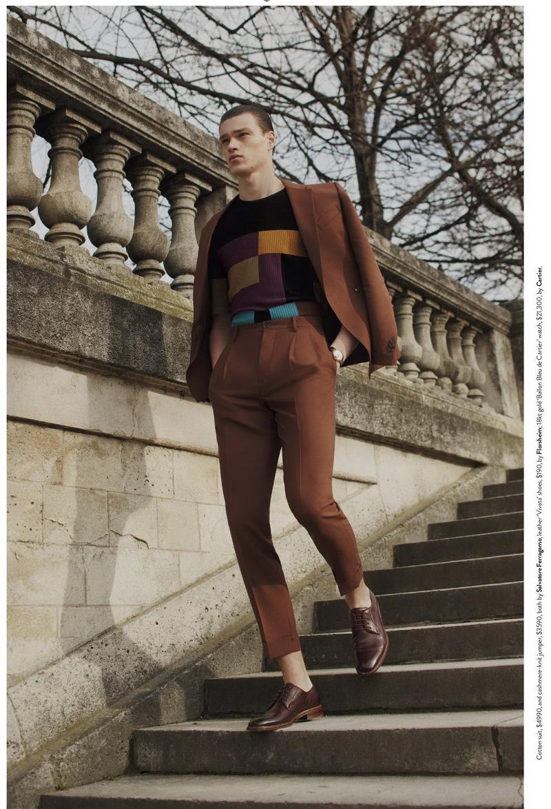 Filip Hrivnak has a geometric moment in a graphic jumper and brown tailored suit from Salvatore Ferragamo.