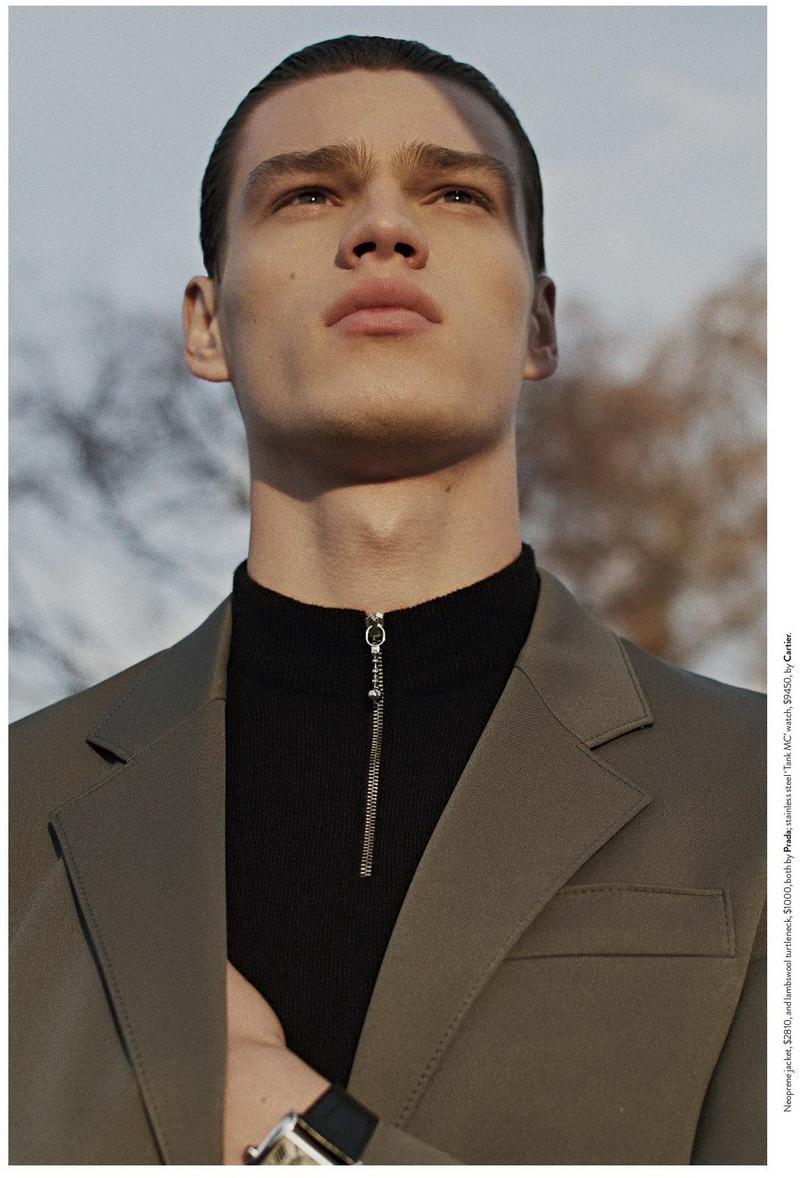 A sporty aesthetic is realized with the combination of a neoprene jacket and zip-up turtleneck from Prada.