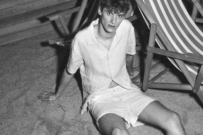 Damien Vernieuwe wears a short-sleeve linen shirt and boxer swim trunks for Fox Haus' summer 2016 campaign.