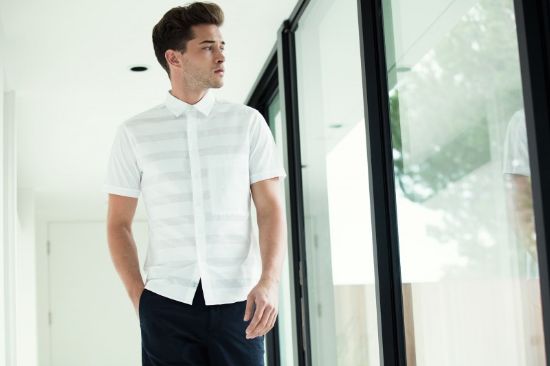 Wearing a short-sleeve stripe shirt, Francisco Lachowski models 7 Diamonds' fresh take on summer white.