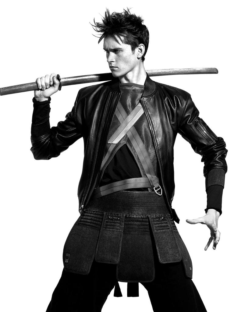 Anders Hayward wears jacket Ralph Lauren, mesh vest Wooyoungmi, top Acne Studios and trousers Vivienne Westwood.