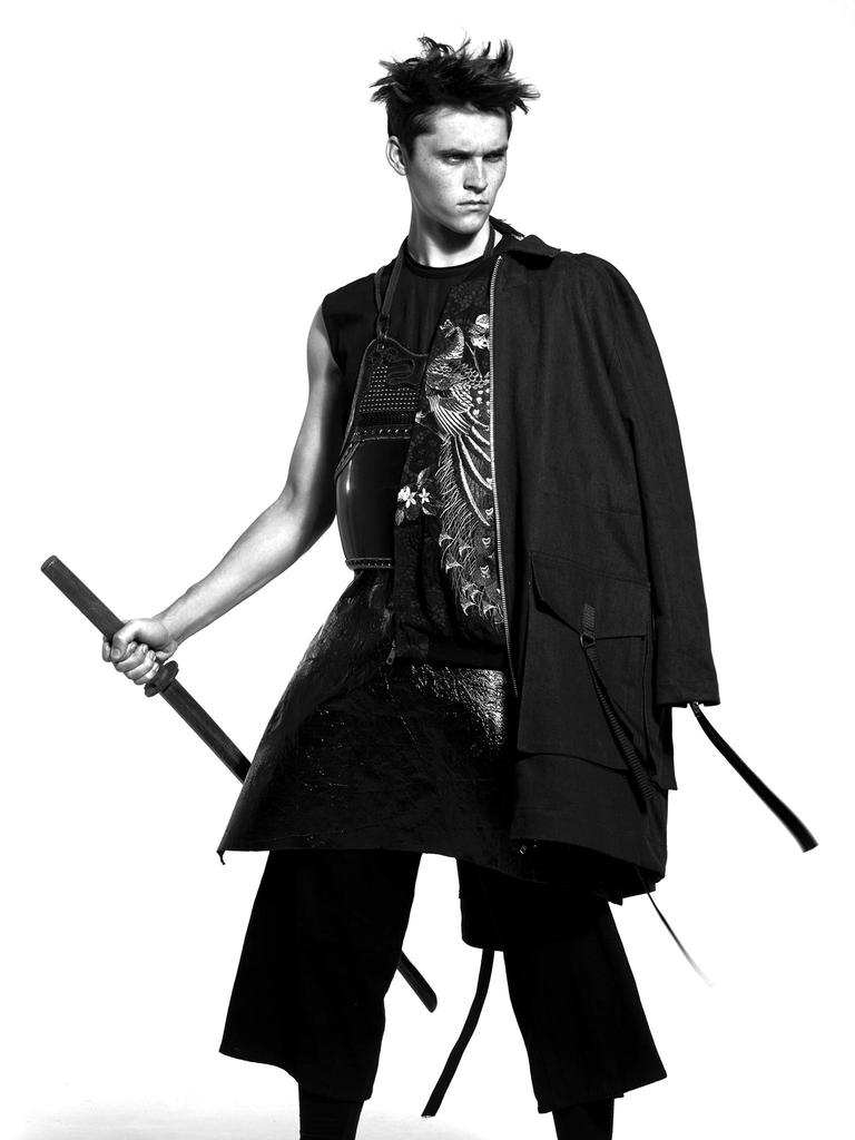 Anders Hayward wears coat Adyn, jacket Dolce & Gabbana, tunic Rick Owens and trousers JUUN.J.