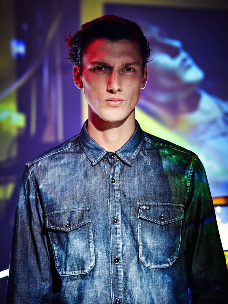 Luca Stascheit wears denim shirt 7 For All Mankind.