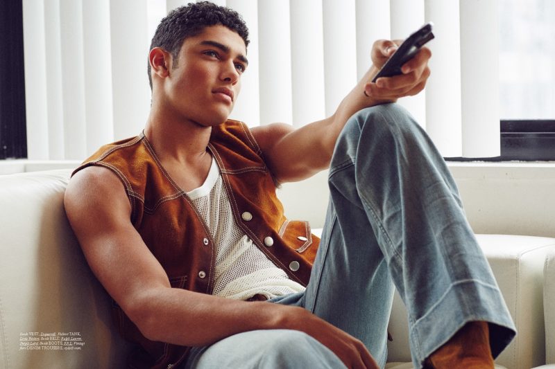 Torin Verdone relaxes in a suede vest from Dsquared2, paired with Louis Vuitton's mesh tank and other covetable items.