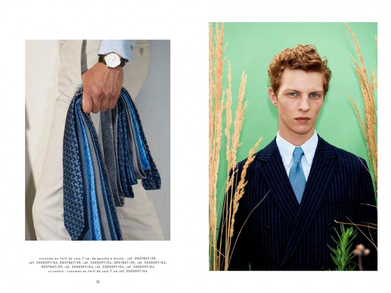 Tim Schuhmacher dons a pinstripe suit with an ornate scarf from Hermès' latest collection.