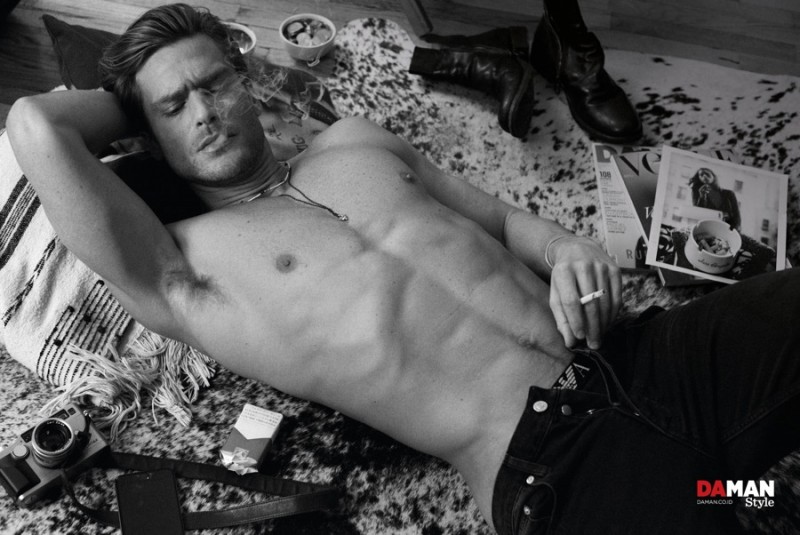 Jason Morgan poses in Emporio Armani underwear and black jeans from Sandro.