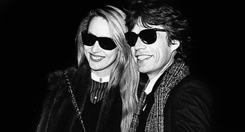 Jerry Hall and Mick Jagger captured in Vuarnet's 02 Model sunglasses. The celebrated style was created in 1957 by Roger Pouilloux and gifted to skier Jean Vuarnet Pouilloux. The skier wore the style in 1960 as he skied towards a gold medal at the 1960 winter Olympic games. 