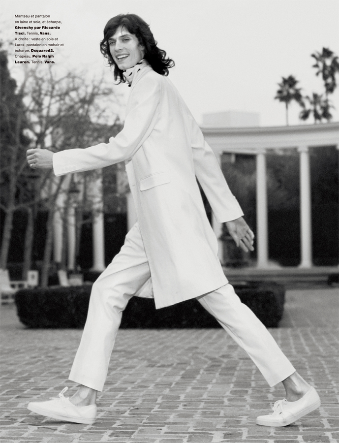 Justin Gossman is a chic vision in a white ensemble from Givenchy.