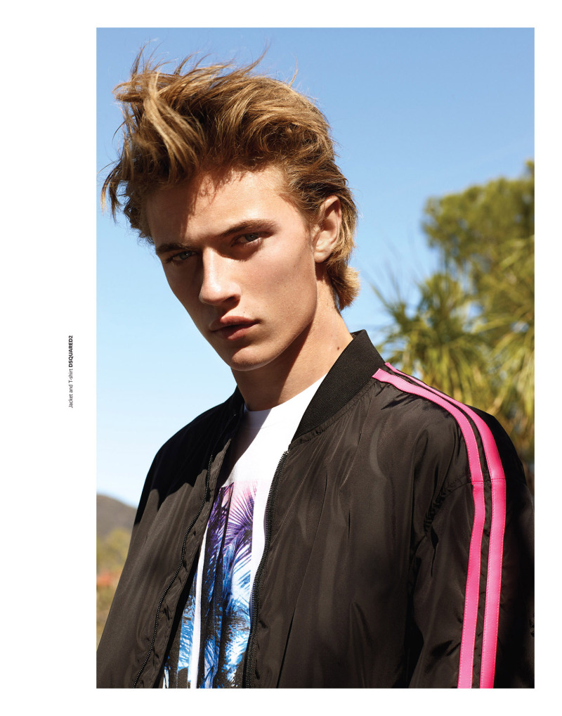 Lucky Blue Smith wears t-shirt and track jacket Dsquared2.