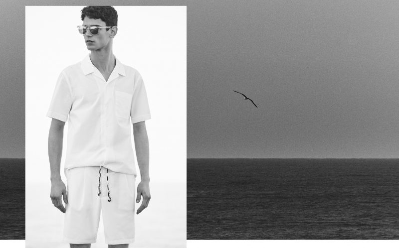 Arthur Gosse wears short-sleeve shirt, Bermuda shorts and sunglasses Mango.