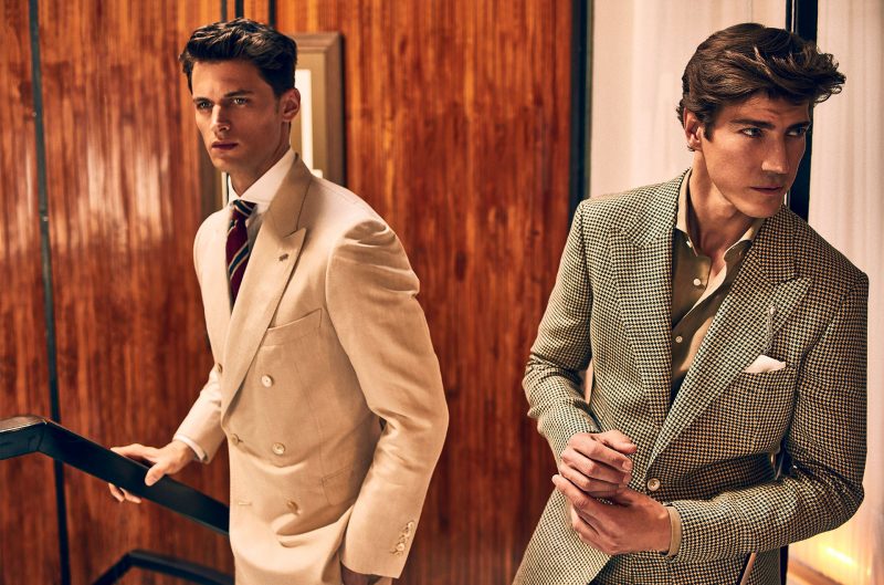 Pictured left to right, models Garrett Neff and Oriol Elcacho are a luxurious vision for Massimo Dutti. While Garrett dons a double-breasted linen suit, Oriol charm in a houndstooth jacket.