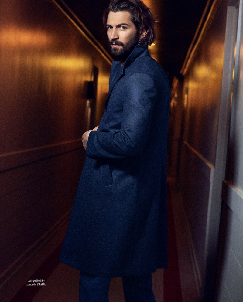 Michiel Huisman sports a sharp coat from BOSS by Hugo Boss with Prada trousers.