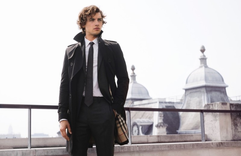 Josh Whitehouse dons a black trench for Mr. Burberry's campaign.