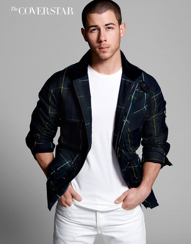 Nick Jonas completes a white look with a plaid Polo Ralph Lauren jacket.