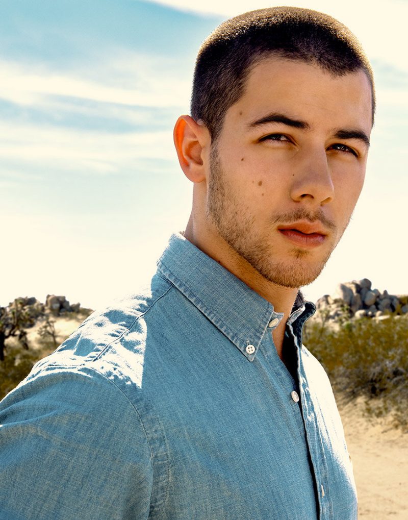 Nick Jonas photographed by Yu Tsai in a casual denim shirt.