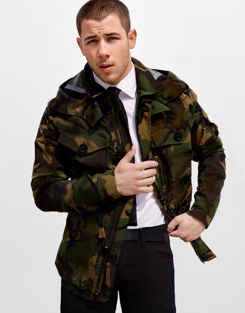 Nick Jonas wears a camouflage jacket from Polo Ralph Lauren.