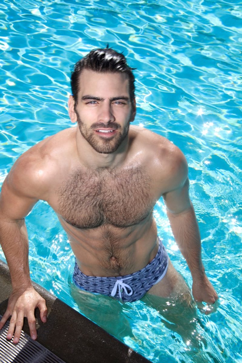 Nyle DiMarco enjoys a day in the pool, wearing 2(X)IST swimwear.