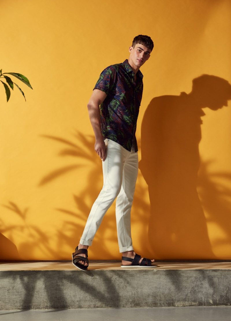 Alessio Pozzi goes casual for Primark's summer 2016 campaign, sporting white jeans with a short-sleeve Hawaiian shirt.