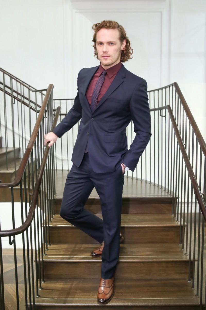 Sam Heughan pictured in a Burberry suit at a launch event for Mr. Burberry.