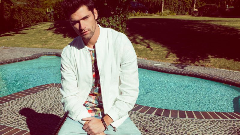 Sean O'Pry pictured in a white bomber jacket for Penshoppe's summer 2016 campaign.