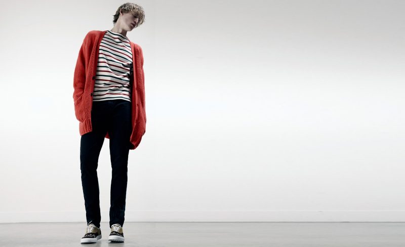 Henry Evans wears cardigan Raey, striped tee Gucci, trousers Lanvin and sneakers Orley.