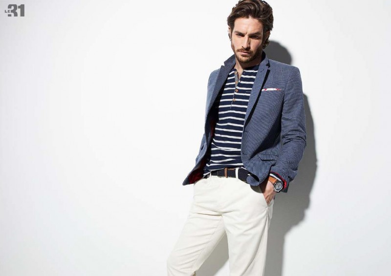 Justice Joslin embraces a preppy look in a striped henley with a smart blazer and chinos from Simons LE 31.