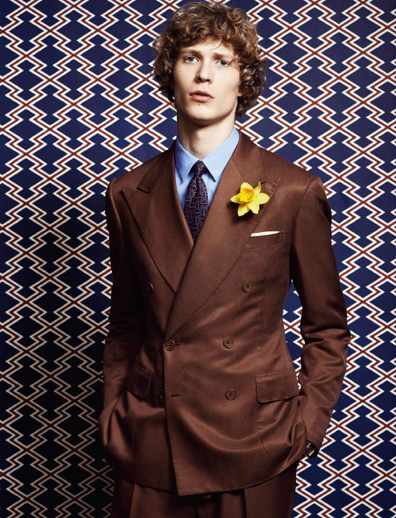 Sven de Vries sports a Salvatore Ferragamo double-breasted suit in a rich brown.