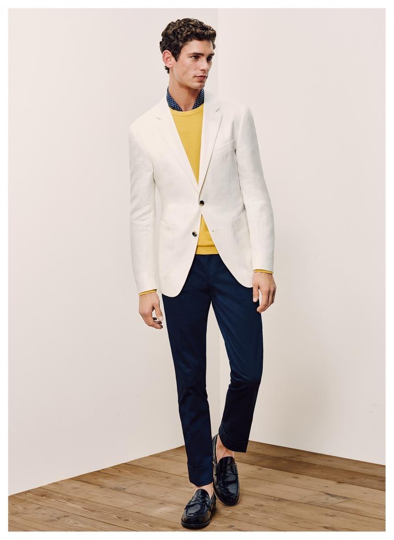 Arthur Gosse embraces smart suiting separates from Tommy Hilfiger Tailored, wearing navy and white together.