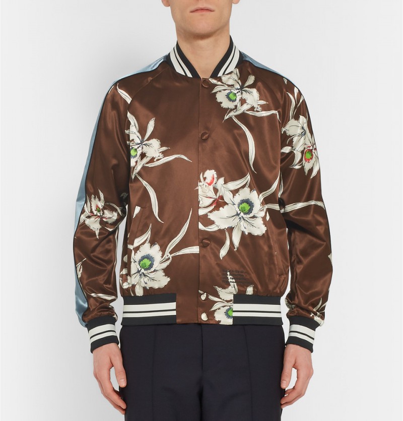 Valentino Printed Satin Souvenir Jacket: Valentino creative directors Maria Chiuri and Pier Piccioli make a strong case for the souvenir jacket with their gorgeous spin on the classic. The design duo embrace satin and oriental orchids for the statement jacket.