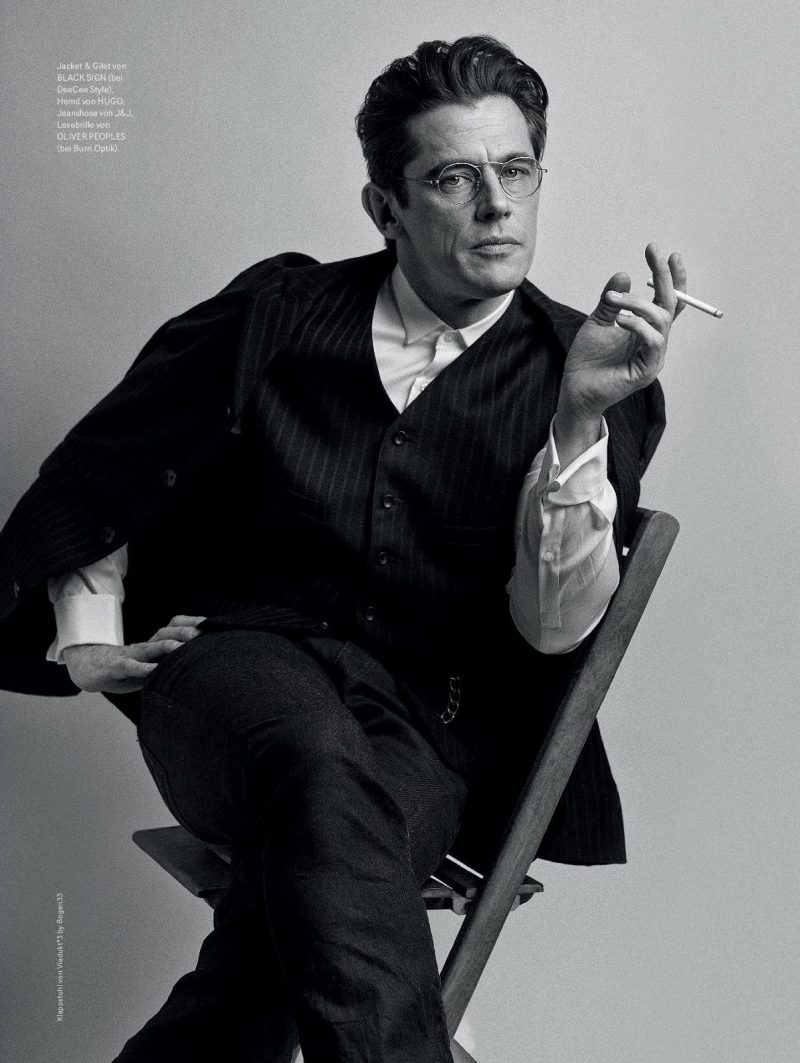 Werner Schreyer enjoys a cigarette in a black & white photo, captured by Cyrill Matter.