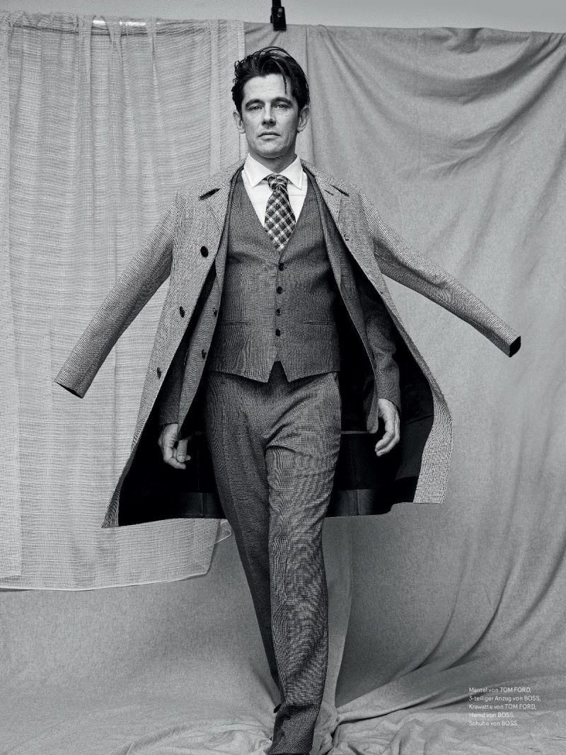 Werner Schreyer goes sartorial in a three-piece BOSS suit with a sharp overcoat.