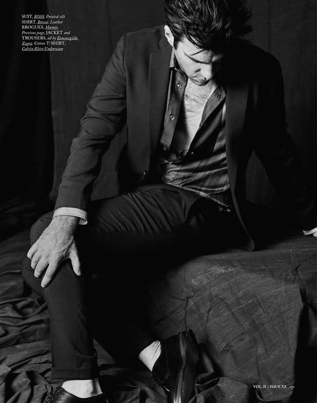 Zachary Quinto poses for a moody image in a BOSS suit and silk shirt from Brioni.