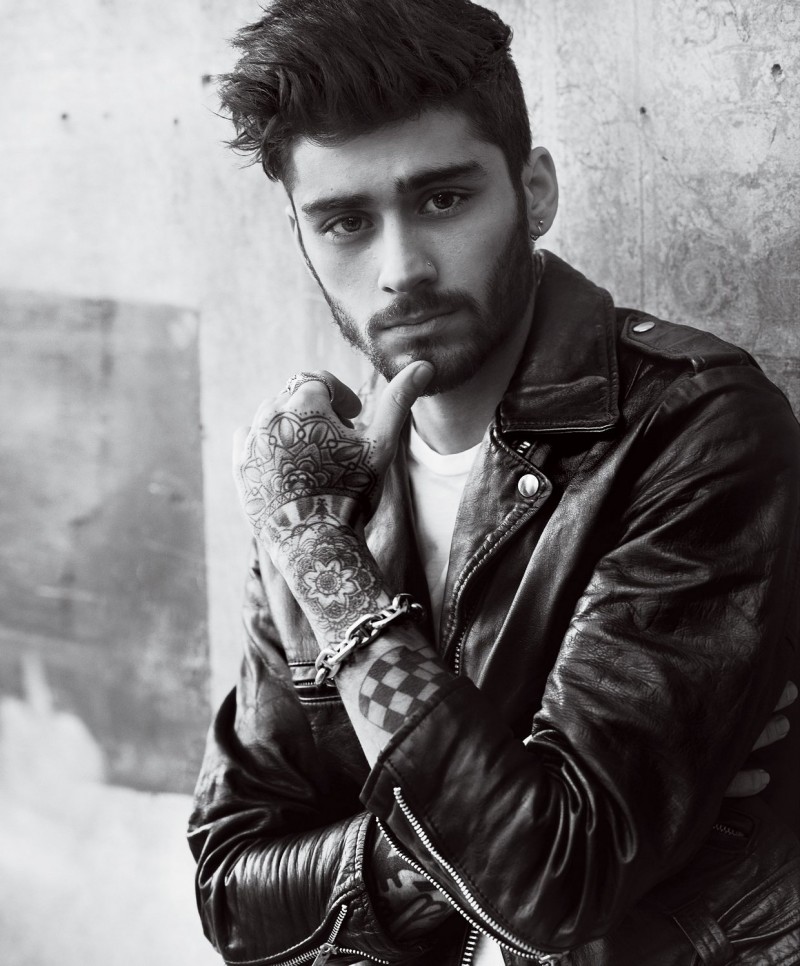 Zayn Malik photographed by Mario Testino in a leather biker jacket for American Vogue.