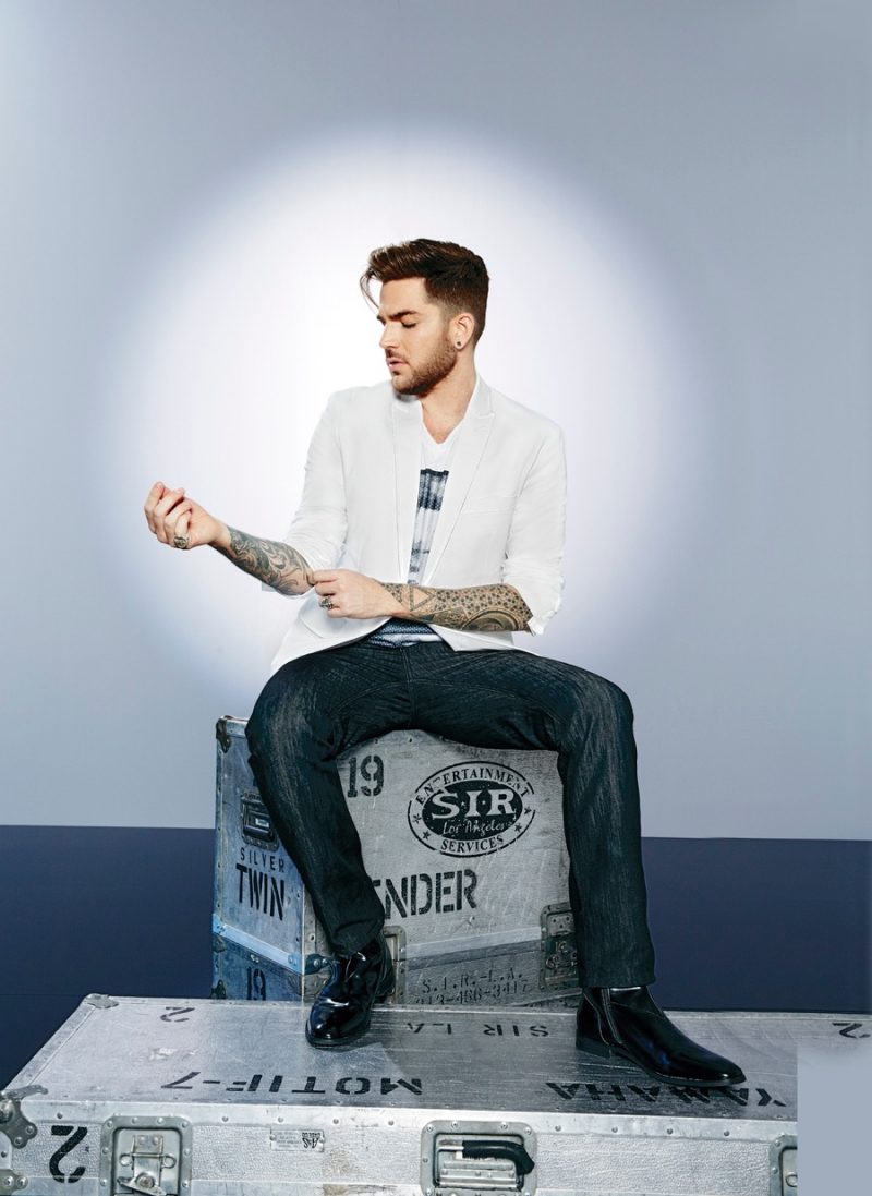 Adam Lambert sports a tailored blazer with denim jeans and a graphic t-shirt from INC International Concepts.