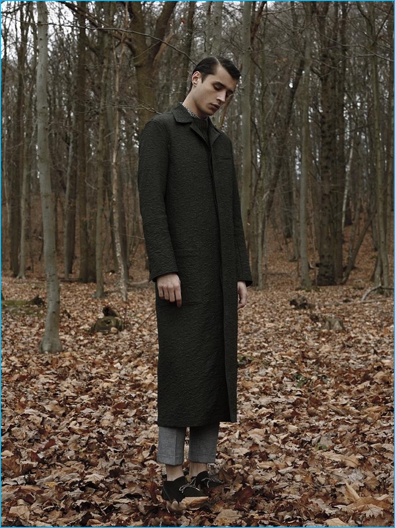 Adrien Sahores pictured in a long tailored coat from Carven.