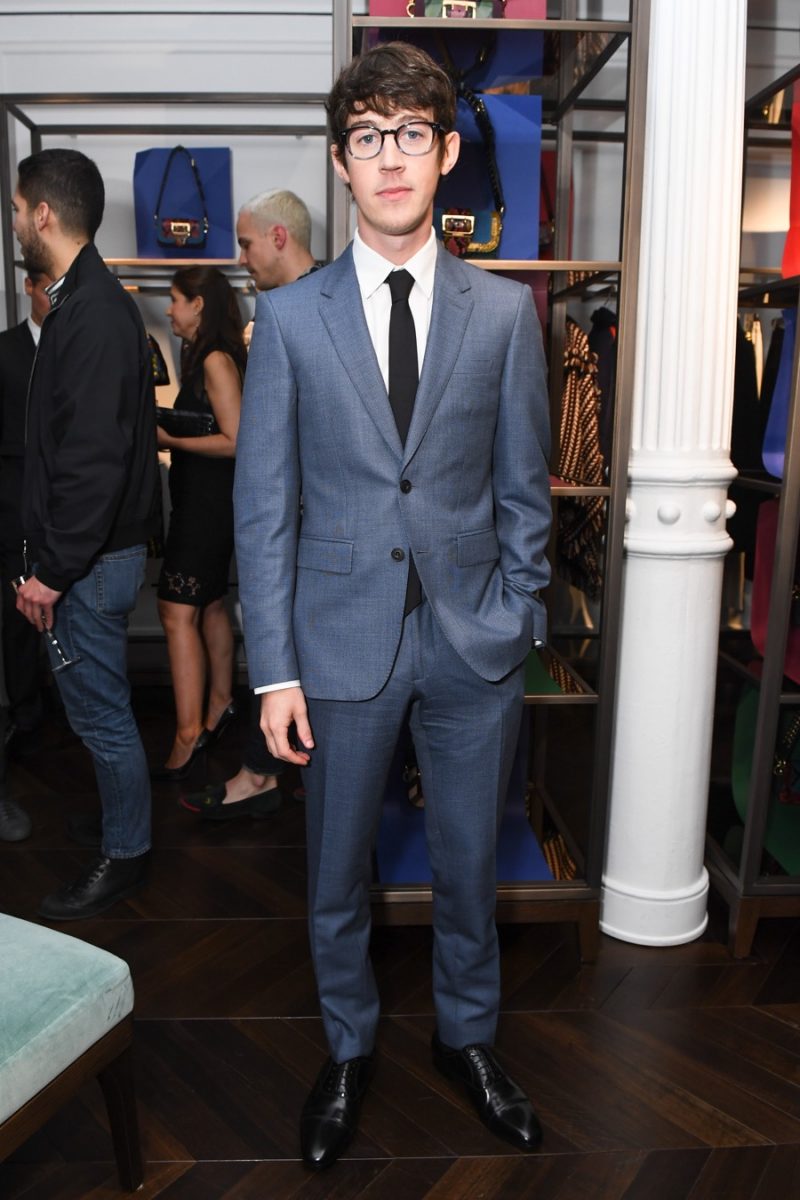 English actor Alex Sharp cleans up in a grey two-button suit from Burberry.