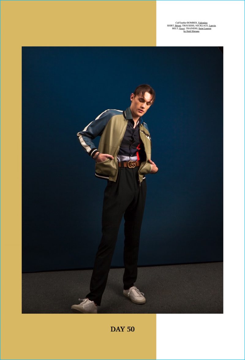 Alexander Stoltz models a Valentino bomber jacket with a Brioni shirt, Lanvin trousers and a Gucci GG logo belt.
