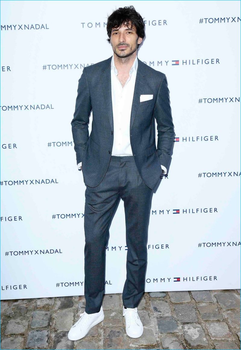 Andres Velencoso Segura makes a case for the suit and sneakers, attending Tommy Hilfiger's pop-up tennis tournament. 