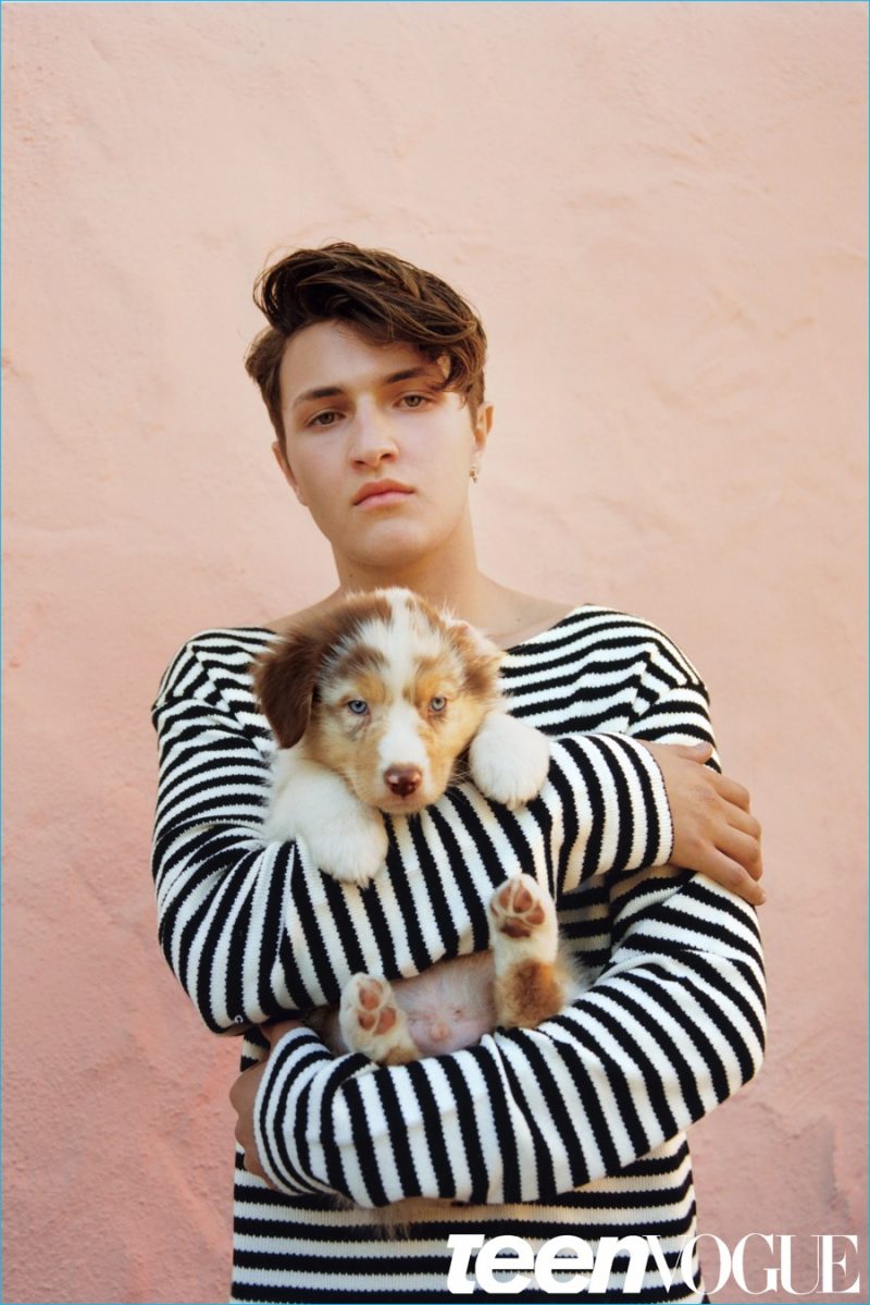 Anwar Hadid sports a striped Gucci sweater.