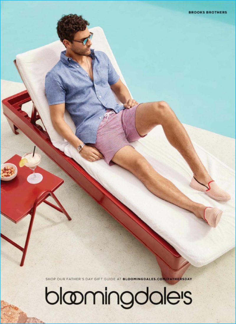Noah Mills relaxes poolside in Brooks Brothers.
