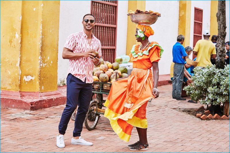 Wearing a pink Ikat shirt with navy joggers, Nathan Owens explores Cartagena, Colombia with Bonobos.