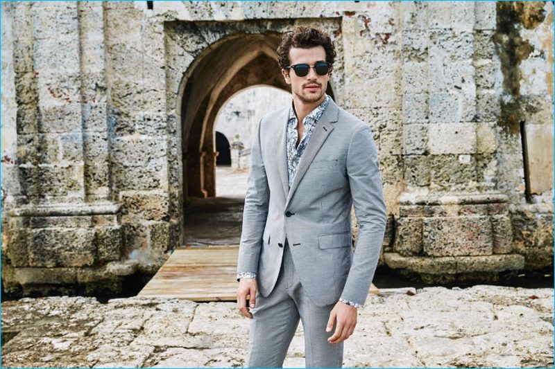 Paul Kelly goes for a timeless appeal in a grey two-button suit from Bonobos. 